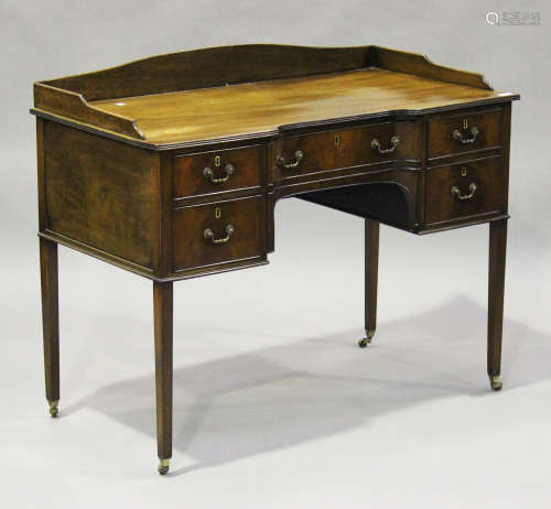 A 19th century mahogany inverted bowfront writing table, the galleried back above five drawers,