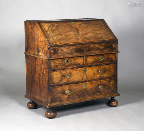 A good Queen Anne walnut bureau with overall feather banding and double-reeded moudings, the fall