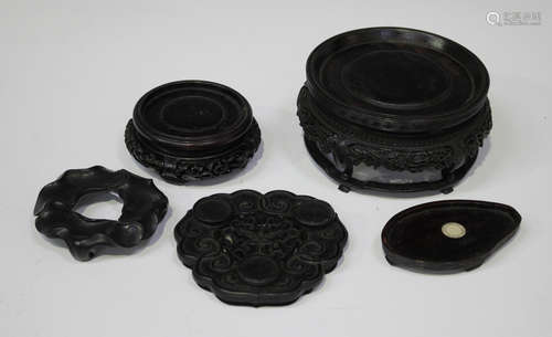 A Chinese carved hardwood circular stand, late Qing dynasty, with finely carved keyfret rim and