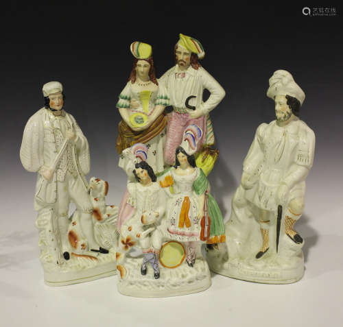 A large mixed group of Staffordshire figures, mid to late 19th century, including The Lion Slayer,