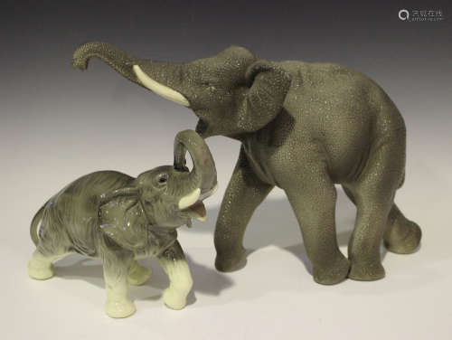 An Art Deco Vinsare Sèvres model of an elephant, 1940s, modelled with raised trunk, height 30cm,
