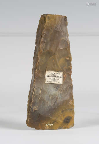 A Scandinavian Neolithic chipped stone axe head, bearing 'F.S. Clark Collection' label, detailed '