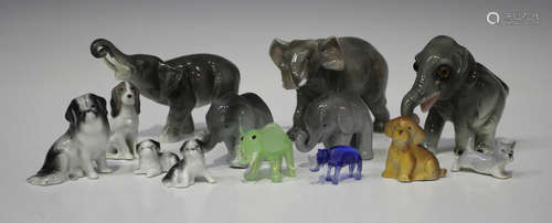 A collection of assorted ceramic and glass animals and figures, including a Plichta mottled pink