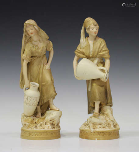 A pair of Royal Dux porcelain figures, early 20th century, modelled as male and female water