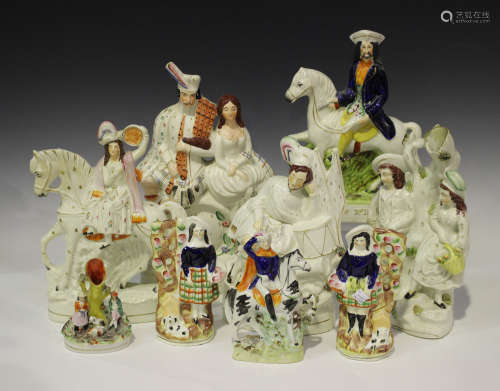 A large mixed group of Staffordshire figures, late 19th century, including an equestrian Tom King,