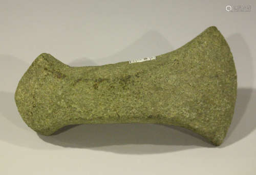 A Danish Neolithic pecked stone axe head of part perforated boat form, bearing 'F.S. Clark