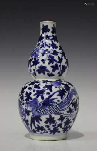 A Chinese blue and white porcelain bottle vase, mark of Kangxi but later 19th century, painted