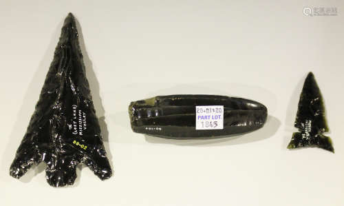 A group of three American obsidian artefacts, comprising a core and two arrowheads, one
