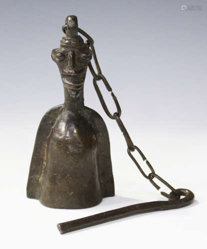 An African patinated bronze bell of half-length figural form, possibly Benin, height 14.5cm.Buyer’