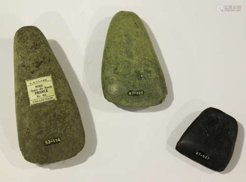 A group of three French Neolithic polished stone axe heads, one bearing 'F.S. Clark Collection'