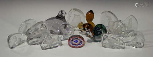 A collection of glass paperweights, 20th century, comprising a Wedgwood brown tinted squirrel, a