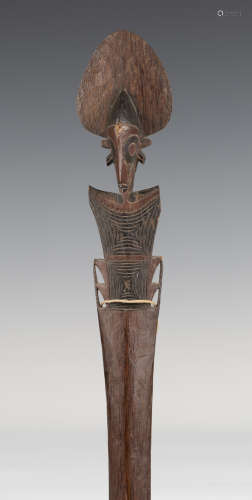 A Buka Island palmwood ceremonial paddle, Solomon Islands, Melanesia, the Janus head finial with a