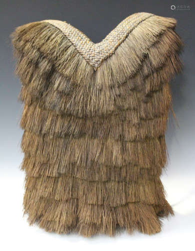 A 20th century tribal woven rattan and grass back pack baby carrier, length 54cm.Buyer’s Premium