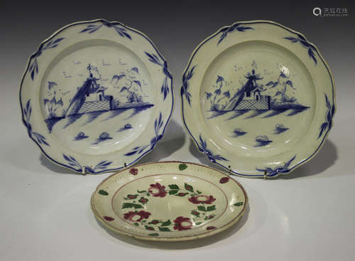 A pair of blue painted pearlware plates, early 19th century, each with a chinoiserie scene, diameter