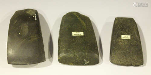 A group of three New Zealand polished stone axe heads, one bearing F.S. Clark monogram, length 10cm,