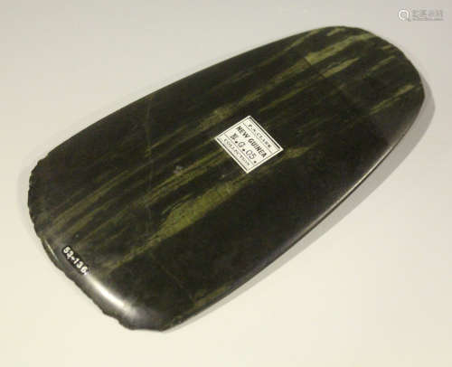 A New Guinea polished stone axe head, bearing 'F.S. Clark Collection' label, detailed 'New Guinea'