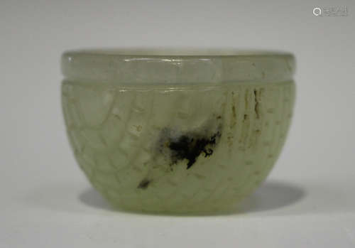 A Chinese small pale celadon jade wine or water cup, Qing dynasty, possibly 18th century, carved