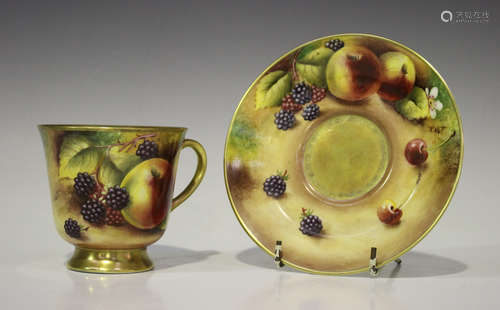 A porcelain cup and saucer, 20th century, painted by the Worcester artist Terence Nutt, signed, with