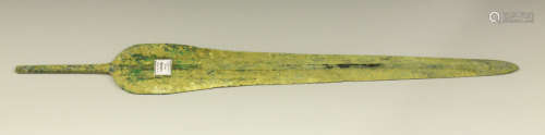 An ancient bronze Luristan spear head of elongated leaf form, bearing 'F.S. Clark Collection' label,