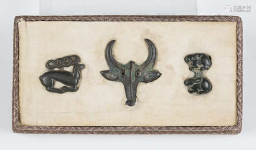 A group of three Ordos culture green/brown patinated bronze plaques, 3rd-1st century BC,