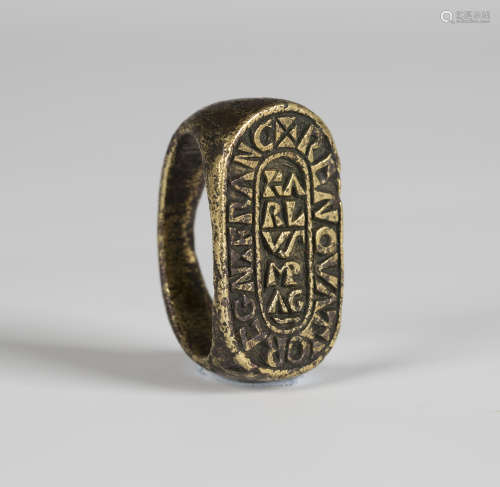 An ancient bronze seal ring, possibly 9th-11th century, Frankish, the curve-ended matrix detailed '