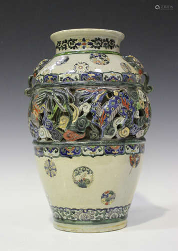 A Japanese earthenware vase, Meiji period, the ovoid body with polychrome enamelled reticulated