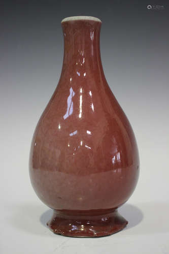 A Chinese sang-de-boeuf glazed porcelain bottle vase, Qing dynasty, of ovoid form with narrow