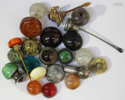 A collection of Chinese snuff bottle stoppers, mostly late Qing dynasty, including jade, agate, rock