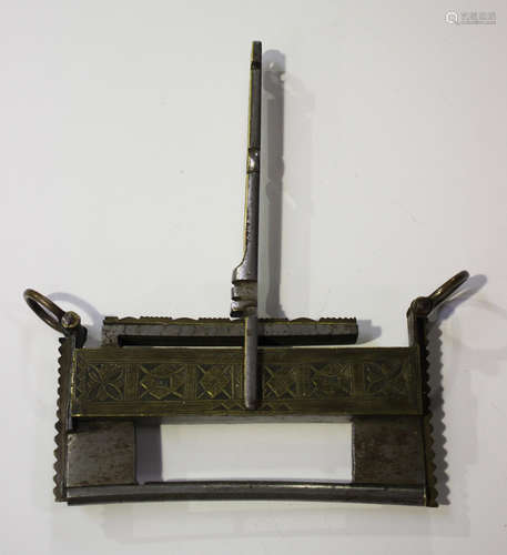 A Chinese brass and steel padlock and key, probably Qing dynasty, the lock constructed in two parts,