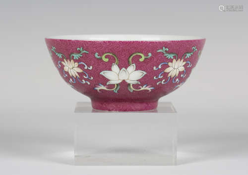 A Chinese famille rose ruby sgraffito ground porcelain bowl, mark of Qianlong and possibly of the