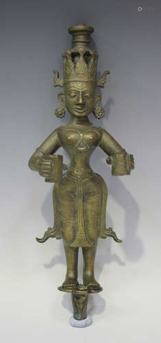 A South Indian bronze votive lamp figure of Lakshmi, 18th/19th century, modelled standing, holding