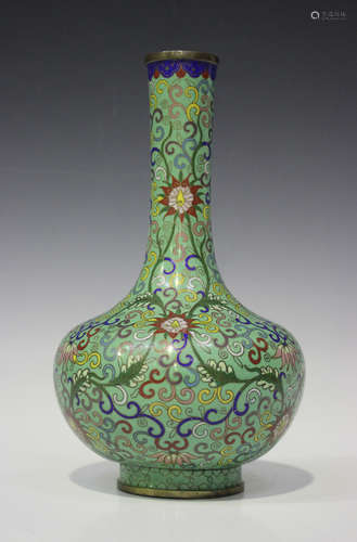 A Chinese cloisonné pale green ground bottle vase, early 20th century, the bulbous body with