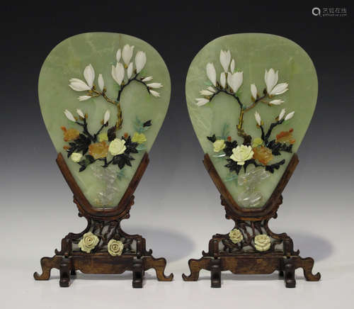 A pair of Chinese jadeite panels, 20th century, each of fan shape, applied with hardstones forming