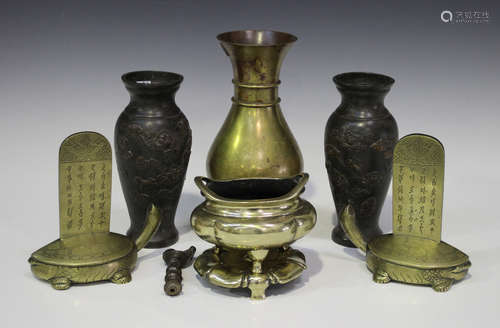 A small group of Oriental metalware, 19th century and later, including a pair of Japanese brown