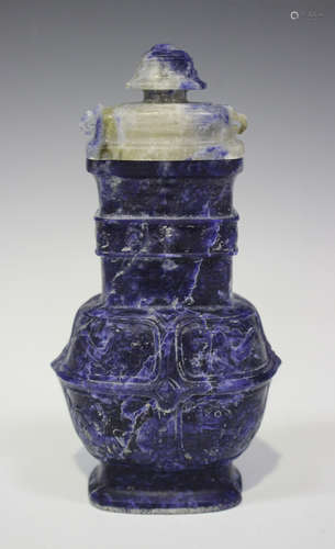 A Chinese archaistic lapis lazuli vase and cover, 20th century, the body carved in low relief with