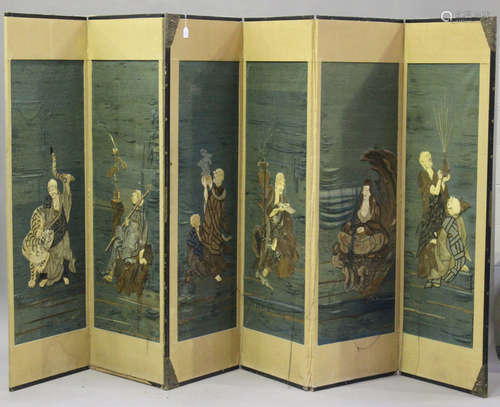 A Japanese embroidered four-fold screen, Meiji period, each panel worked to one side in coloured