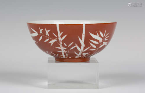 A Chinese white on coral ground hemispherical porcelain bowl, mark and period of Daoguang, the