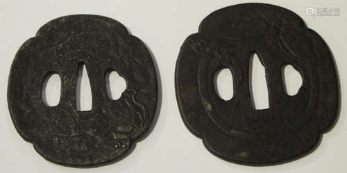 Two Japanese iron tsuba, Edo period, each of quatrelobed outline, one cast in low relief with