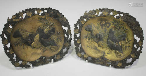 A group of four Japanese antimony dishes, Meiji period, comprising a pair moulded in relief with