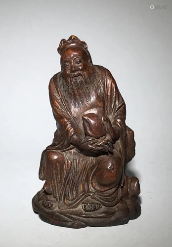 A Carved Bamboo Old man holding Peach