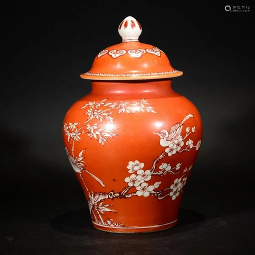 A CORAL RED 'SOLDIER' JAR WITH CARVED