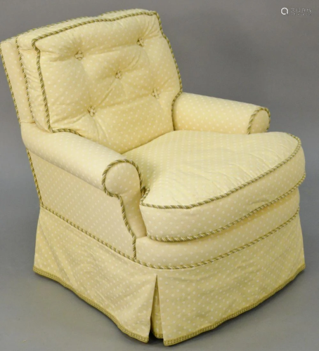 Custom upholstered easy chair (slight fading on left).