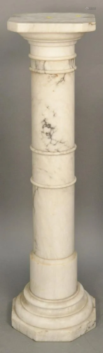 White marble pedestal. ht: 42 1/2