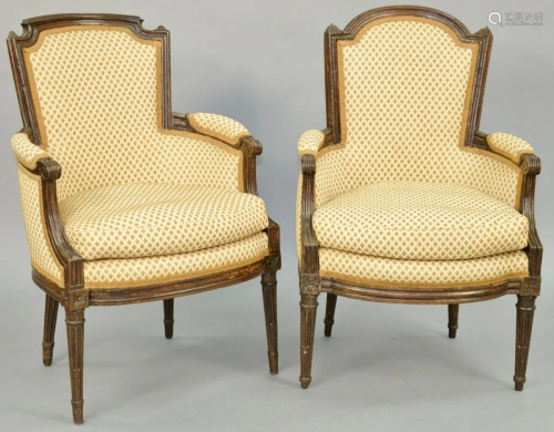 A Matched Pair of Louis XVI Walnut Bergeres, late 18th