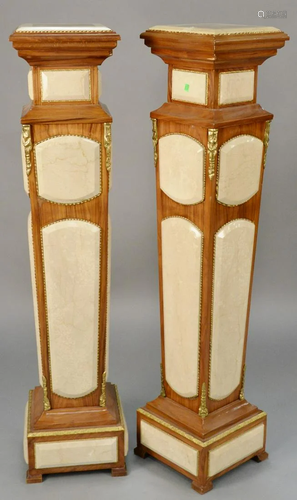 Pair of pedestals with faux marble panels. ht. 54 in.