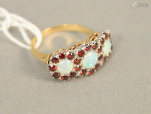 14K gold ring set with three opals each surrounded by