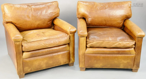 Pair of brown leather easy chairs. ht. 31 in., wd. 32