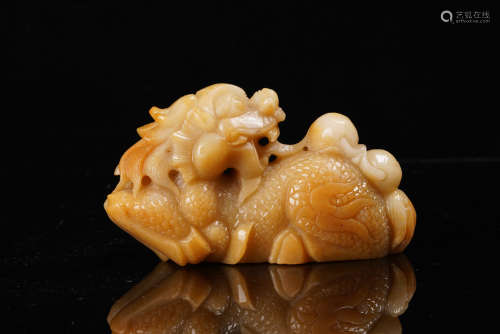 A Chinese Carved Yellow Jade Figure.