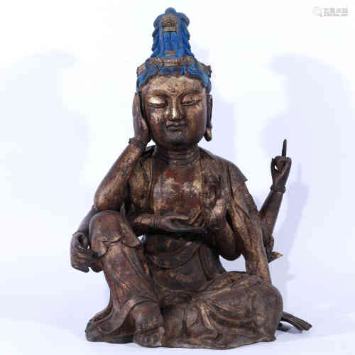 A Chinese Gilt Bronze Statue of Six-Arm Kwan-yin.