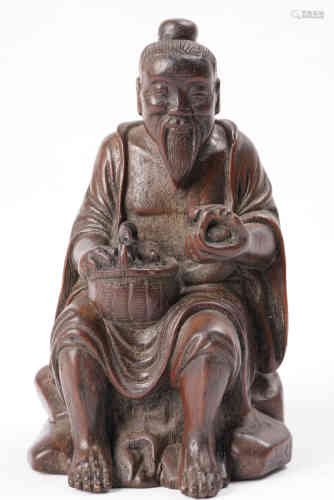 A Chinese Carved Eaglewood Figure.